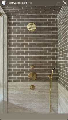 a shower head and hand shower in a bathroom