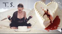 a woman sitting in front of a heart shaped cake