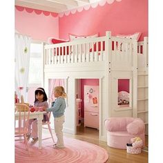 two girls playing in a pink bedroom with white bunk beds and stairs to the upper floor