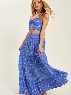 Featuring a captivating blend of floral prints and a flattering midi length, this skirt effortlessly embodies free-spirited vibes, making it a must-have for your everyday adventures. Spring Breezy Gathered Maxi Skirt, Breezy Flowy Maxi Skirt For Day Out, Flowy Breezy Maxi Skirt For Day Out, Breezy Maxi Skirt For Day Out, Spring Breezy Flared Maxi Skirt, Breezy Tiered Maxi Skirt With Lining, Breezy Tiered Lined Maxi Skirt, Breezy Flared Maxi Skirt For Spring, Spring Vacation Maxi Skirt With Gathered Detail