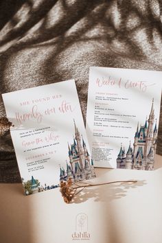 the wedding stationery is set up on top of an open book