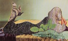 a woman laying on top of a bed next to a spider web covered tree trunk