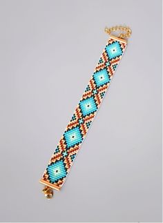 a beaded bracelet on a gold chain