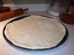 the dough is ready to be baked on the counter for making pizzas in the kitchen