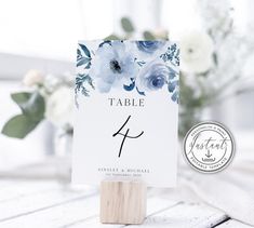 a table number card holder with blue flowers