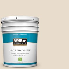 the behr paint and primer in one is shown on a gray background with red trim