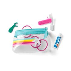 an assortment of toothbrushes and dental floss in a plastic bag on a white background