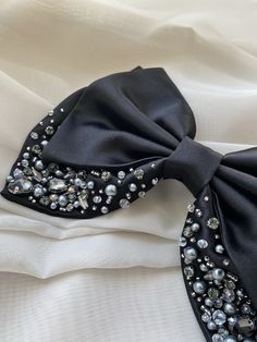 Black satin clamp bow with rhinestones. This beautiful bow clamp will create your best stylish and romantic look! Every detail is handcrafted, every bead stitched by hand (we never use the glue!). This allows you to be sure it`s a best quality product! Material: Satin, glass crystals, rhinestones, steel clip Width: 19cm (7.4in) All hairpieces beautifully packaged in gift packaging including care instructions for safe keeping! *If you have a desire to change the shape, color or create an individu Bow For Hair, Black Hair Bow, Hair Bow Instructions, Hair Bows Diy Ribbon, Black Hair Accessories, Diy Lace Ribbon Flowers, Hair Clamp, Diy Hair Accessories Ribbon, Big Hair Bows