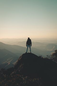 a person standing on top of a mountain