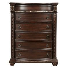 a wooden dresser with drawers and an ornate design on the bottom drawer, in dark brown wood