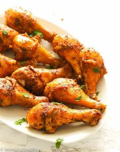 chicken wings on a plate with parsley