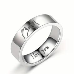 a wedding ring with the words i love you written on it, and an image of a