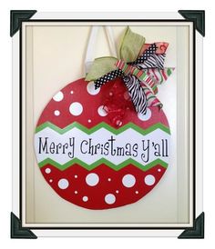 a christmas ornament hanging on a door with the words merry christmas y'all