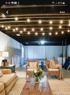 a living room filled with furniture and lights