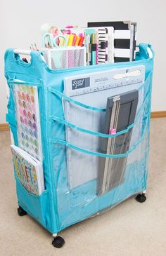 a blue cart filled with lots of office supplies