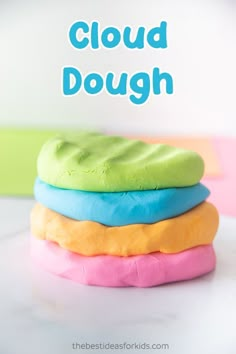 a stack of colorful cookies with the words cloud dough on top