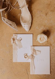 wedding shoes, ring and note laid out on the floor