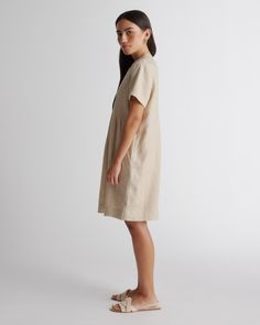 Short-sleeved, relaxed style. Super versatile and easy to wear. Featuring pin-tucking up top, shell buttons, and pleat detailing. Our linen collection is made from 100% European flax linen—an eco-friendly, and resource-light material.  | Quince | Women's 100% European Linen Short Sleeve Swing Dress in Driftwood, Size XL Relaxed Fit V-neck Linen Dress For Work, Relaxed Fit Flax Linen Dress, Casual Linen Pleated Dress, Casual Neutral Linen Dress For Daywear, Casual Neutral Linen Day Dress, Linen Short Sleeve, Linen Collection, Linen Tank, Linen Short