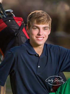 a young man is posing with his golf gear