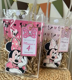 two clear bags with minnie mouse tags on them