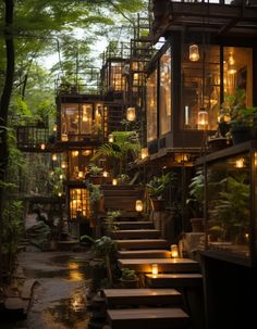 the stairs lead up to an outdoor restaurant with lit candles on each floor and trees in the background