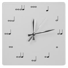 a square clock with musical notes on it