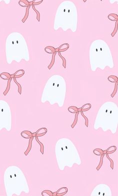 a pink wallpaper with ghost faces and bow ties on it's back ground