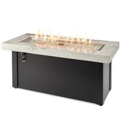 an outdoor fire pit with glowing flames on the top and side panels, in black