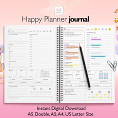 the happy planner journal is open on top of a pink background with flowers and leaves