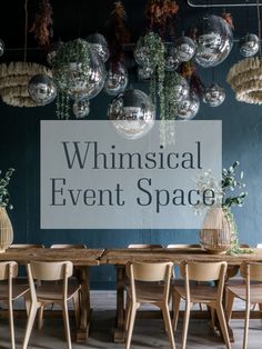 a sign that says whimsical event space hanging from the ceiling