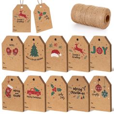 christmas gift tags and twine on white background with brown paper spool for sale