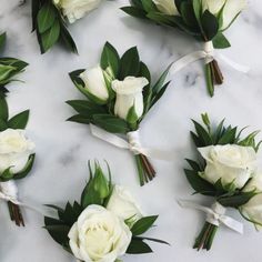 wedding flowers laid out on a marble surface