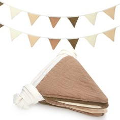 a towel and cloth on a white background with bunting flags in the background,