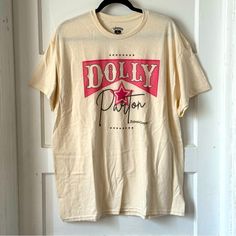 Dolly Parton Signature Unisex T-Shirt Size Xl 100% Cotton The T-Shirt Is Not White & Has A Natural Unbleached Cotton Look To It Measurements Are In The Photos. Color May Be Different In Person Due To Varying Screens & Lighting. I Do My Best To Make Any Issues Clear If None Stated And Pictured Then There Are None. Free But Friendly Home. 5 Star Rated & Quick Shipper. Bundle To Save A Minimum Of 10%. Dolly Parton Signature, Dolly Parton Shirt, Dolly Shirt, Then There Were None, Dolly Parton, Unisex Tshirt, 5 Star, Unisex T Shirt, Womens Tops