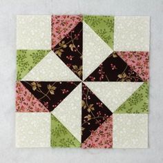 the block is made up of different colors and patterns, including pink, green, brown, and white