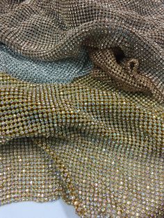 Rhinestone mesh sheet made of high-quality crystal rhinestones. very Flexible This is regular not for ironing Can be cut into any sizes to be used and applied as pleased Size: 48 x 18 Inches stone size : available on 4mm Colors: Gold AB SILVER SILVER AB More rhinestone Sheets and mesh : https://www.etsy.com/shop/justtrim?ref=hdr_shop_menu&section_id=21646531 Pet Gravestone, Rhinestone Blouse, Rhinestone Fabric, Diy Bra, Sparkle Wallpaper, Rhinestone Rose, Bling Crafts, Chain Fringe, Rhinestone Material