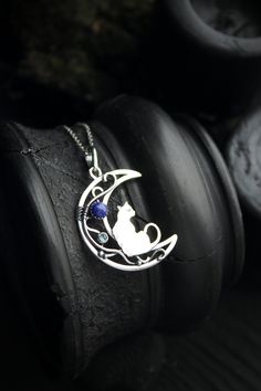 ITEM DESCRIPTION: The size of this moon pendant H 4 cm x W 3 cm. Weight - 4g. You can buy this necklace with a chain or without. Jewelry will come to you in a gift box - ready for gift giving. I made this moon phases necklace of sterling silver, Lapis lazuli, and topaz London. It looks like a real magic art. The handmade silver pendant with the cat will be a great gift for cat lovers. The parcel will be sent during 1-2 days after payment. Delivery usually takes 10-21 days. But in the period from Moon-shaped Necklace With Large Pendant For Gift, Moon Shaped Necklace With Large Pendant For Gift, Cat Design Round Pendant Jewelry Gift, Cat Design Pendant Jewelry, Sterling Silver Cat Design Pendant Necklace, Hammerhead Shark Necklace, Ursula Jewelry, Cat And Moon, Moon Necklace Silver