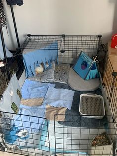 a cage filled with lots of items on top of a floor