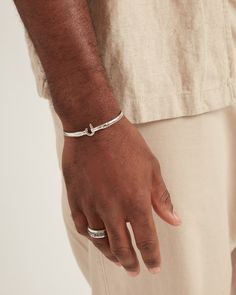 A Vibe signature, the St. John Hook Bracelet is fashioned in gently hammered sterling silver with a "J" hook clasp to honor the island of St. John. Featuring a replica of the St. John petroglyph and seven good luck wraps, solo or stacked, it is sure to be a favorite statement piece. Found in many of our designs, Vibe’s seven good luck wraps represent love, laughter, happiness, good fortune, health, unity, and peace. In the Caribbean tradition, wear your hook facing in to keep love close to your