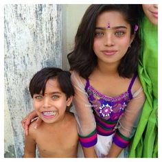 These siblings are probably going to put us in a visual trance with their spectacular eye colors. And we won't mind a bit. Different Skin Tones, Mixed Kids