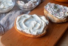 there are two pieces of bread with cream on it next to some other food items