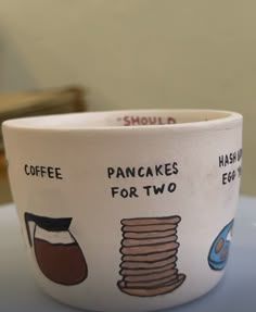 a bowl that has pancakes for two on it and coffee in the bottom with words