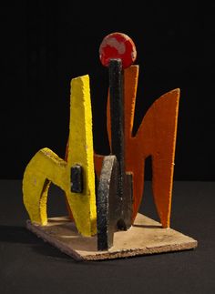 an abstract sculpture made out of wood and metal