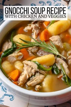 a white bowl filled with chicken and veggies soup on top of a table