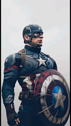 a man dressed as captain america holding a shield