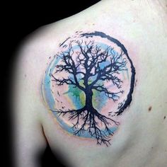 a man with a tree tattoo on his shoulder