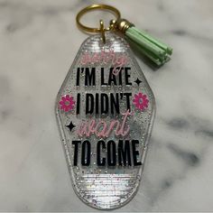 a keychain that says i'm late, i didn't want to come