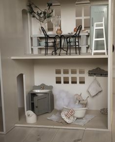 a doll house with furniture and accessories in it