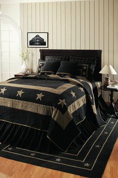 a black and white bed with stars on it