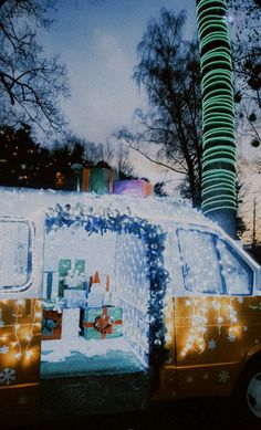 a van is decorated with christmas lights and decorations